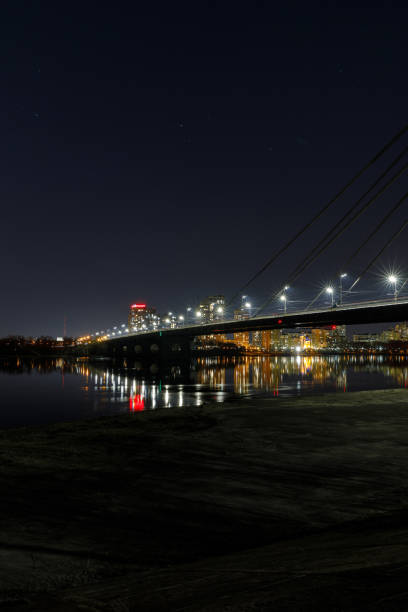 istock cityscape with illuminated buildings, bridge and river at nigth 1149242962