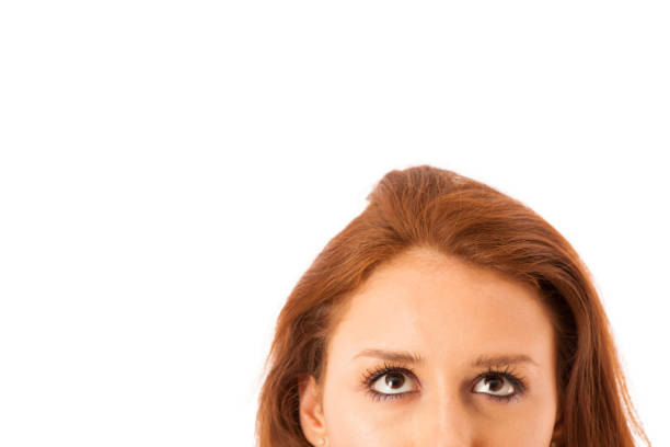 istock Confident business woman curiously looking into copy space isolated over white background 1149243750