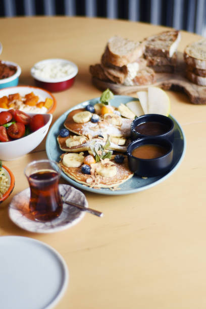 istock Delicious breakfast with pancakes and tea on a table 1149243933
