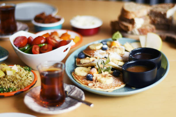 istock Delicious breakfast with pancakes and tea on a table 1149243937