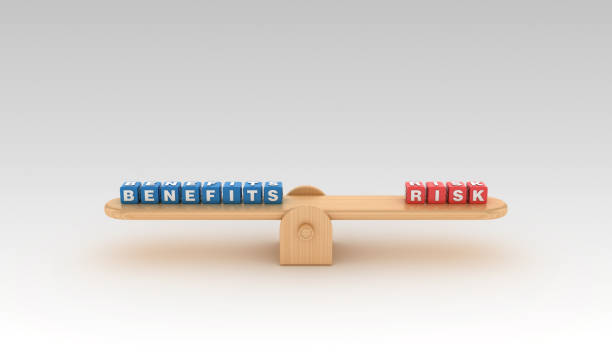 istock Seesaw with BENEFITS RISK Buzzword Cubes - 3D Rendering 1149243944