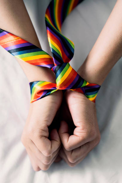 istock man tied up with a rainbow necktie 1149251717