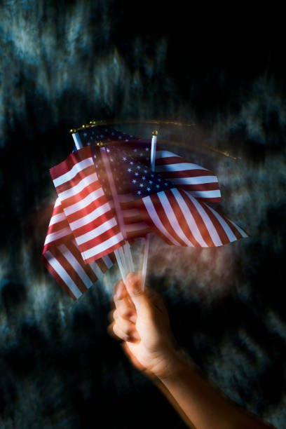 istock man waving some american flags 1149251726