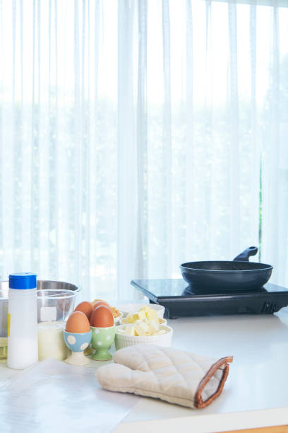 istock Metal black frying pan on Table background in kitchen 1149254370