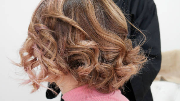 istock Blond hair after treatment with Curling iron 1149258438