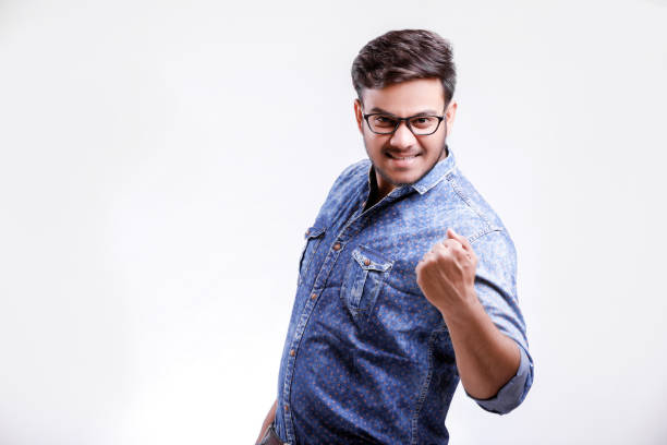 istock Young indian man showing wining confidence 1149258594