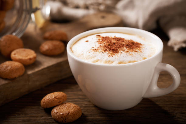 istock cup of cappuccino coffee with cookies 1149259726