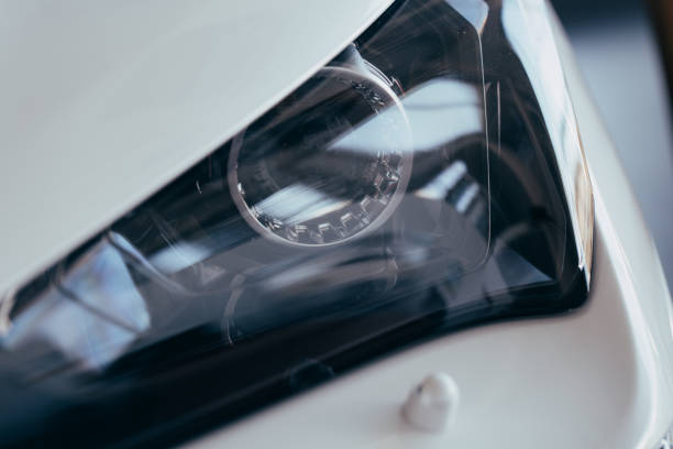 istock headlight of modern prestigious car closeup 1149260162