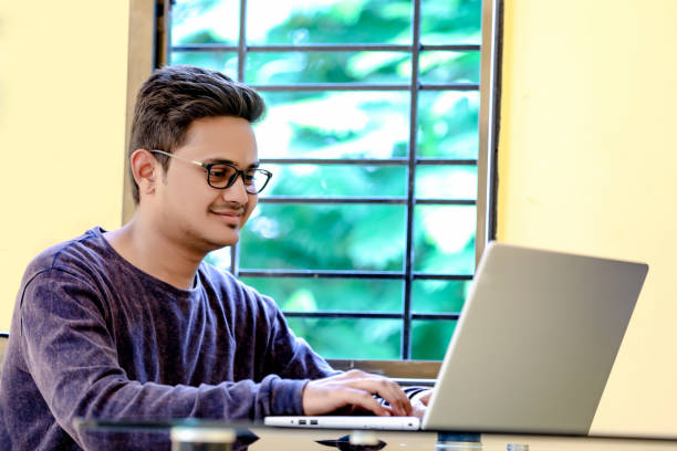 istock Young Indian Man/Student with laptop , Working on Laptop 1149263237