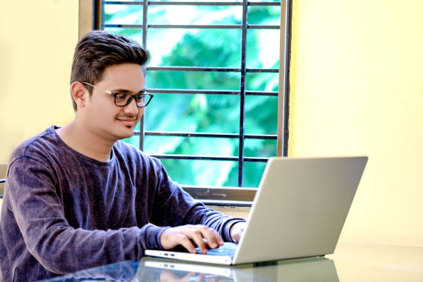 istock Young Indian Man/Student with laptop , Working on Laptop 1149263985