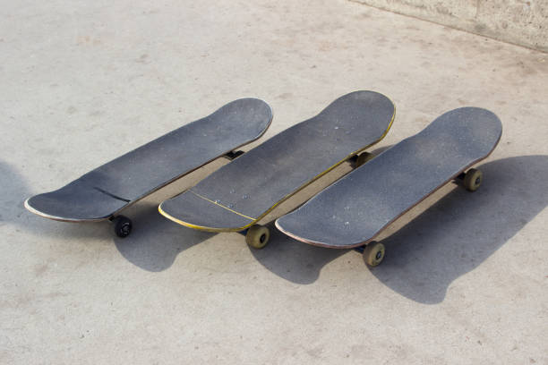 istock three skateboards lay on a concrete surface close up 1149264083