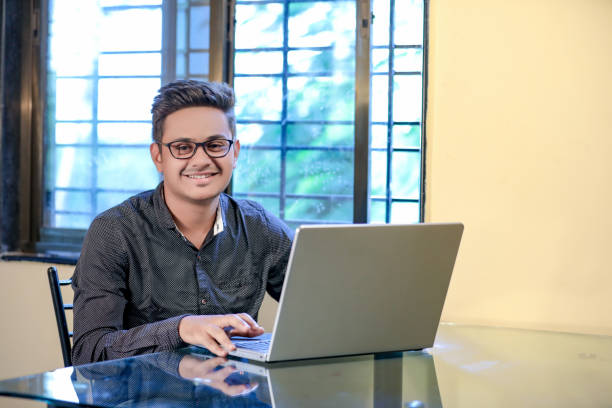 istock Young Indian Man/Student with laptop , Working on Laptop 1149264276