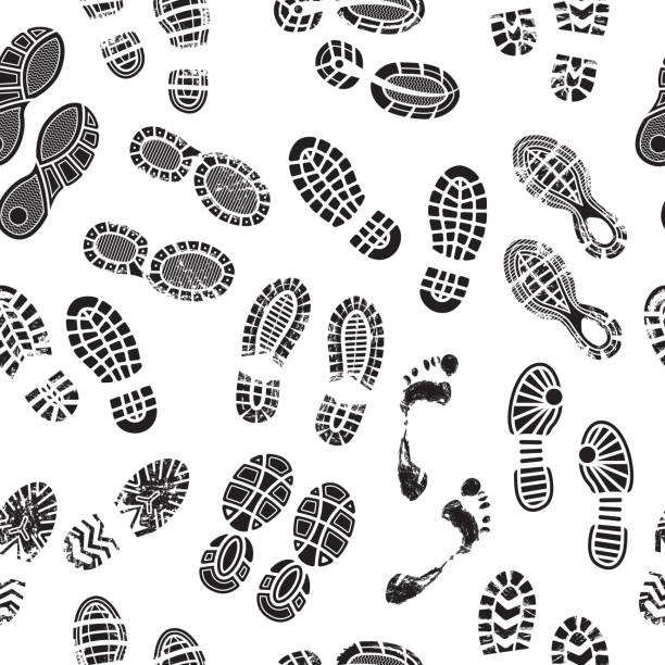 Footprints pattern. Male and female foots silhouettes human shoes walking seamless background vector textile design Footprints pattern. Male and female foots silhouettes human shoes walking seamless background vector textile design. Illustration of foot track, mark print pattern, footprint black people covered in mud stock illustrations