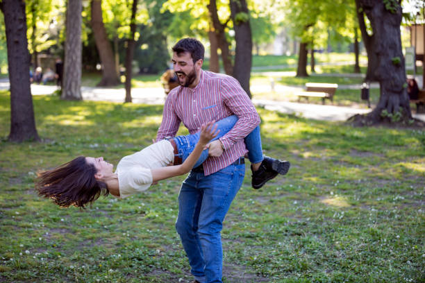 istock Young Couple is Enjoying Springtime in Park 1149265738