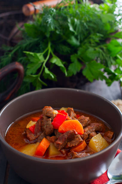 istock Traditional Hungarian goulash on a wooden table, selective focus 1149265803