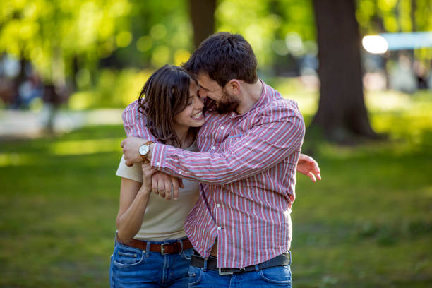 istock Young Couple is Enjoying Springtime in Park 1149265835