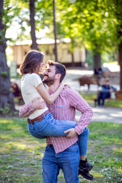 istock Young Couple is Enjoying Springtime in Park 1149266003