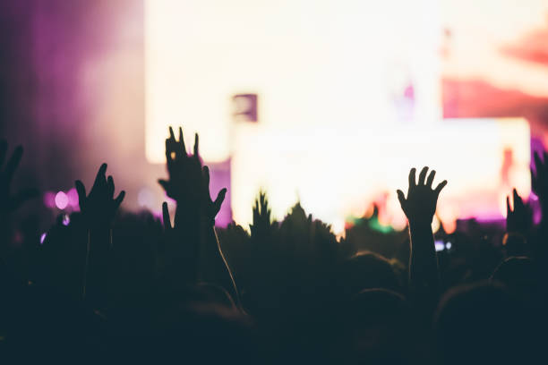 istock Cheering crowd at concert enjoying music performance 1149266144