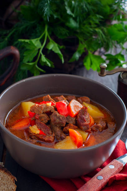 istock Traditional Hungarian goulash on a wooden table, selective focus 1149266335