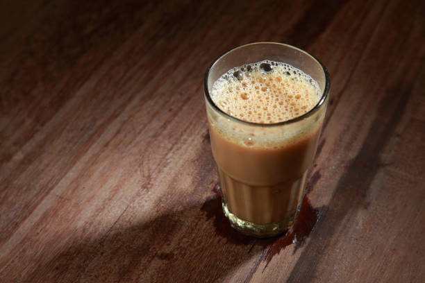 istock A glass of tea on a wooden table. 1149266352