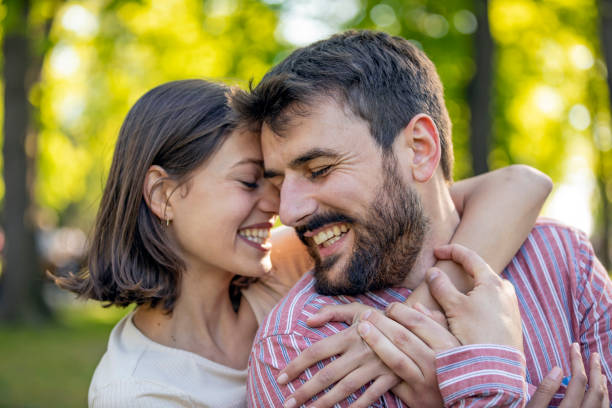 istock Young Couple is Enjoying Springtime in Park 1149266433