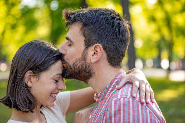 istock Young Couple is Enjoying Springtime in Park 1149266444