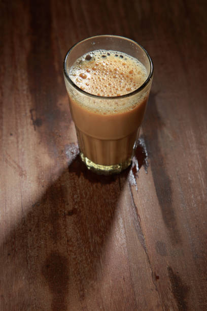 istock A glass of tea on a wooden table. 1149266706