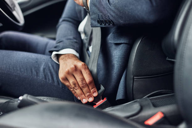 Buckle up before you drive Cropped shot of an unrecognizable man fastening his seatbelt buckle stock pictures, royalty-free photos & images