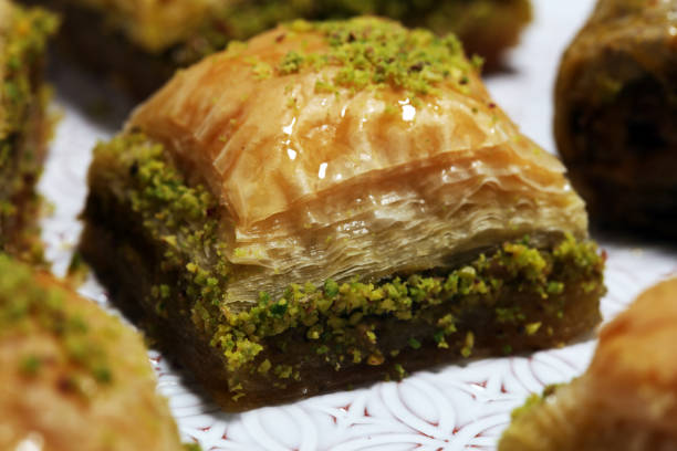 istock Middle eastern or arabic dishes. Turkish Dessert Baklava with pistachio on dishes 1149267331