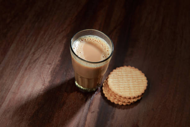 istock A glass of tea and biscuits on a wooden table 1149267493