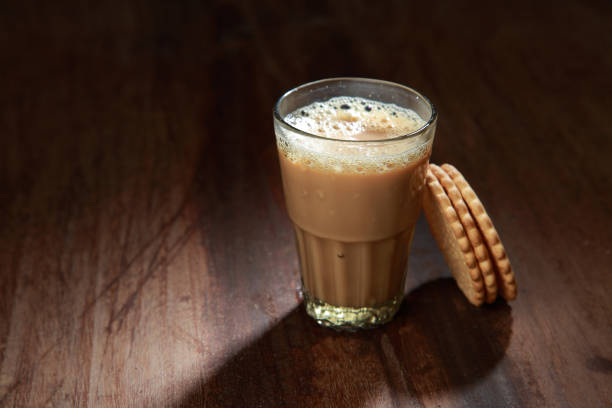 istock A glass of tea and biscuits on a wooden table 1149267497