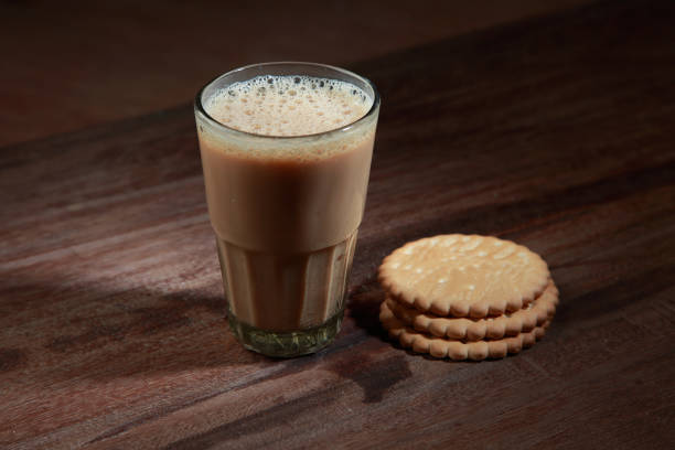 istock A glass of tea and biscuits on a wooden table 1149267548