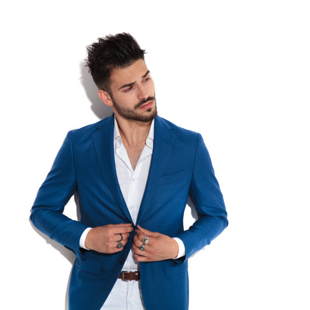 istock Mystified man curiously adjusting his jacket 1149267923