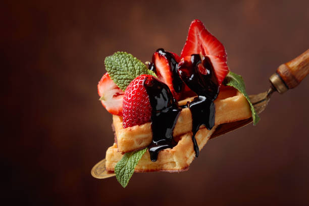 istock Waffles with strawberries, mint and chocolate sauce. 1149268824