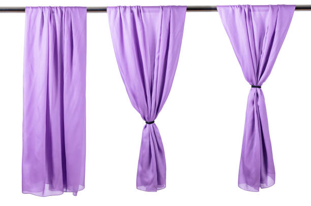 istock Vertical purple satin curtains isolated on white. 1149268847