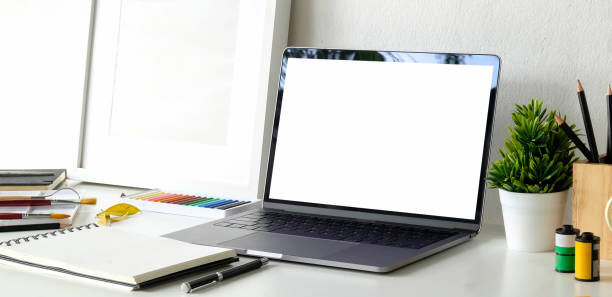 istock Mock up laptop on creative artist workspace 1149269476