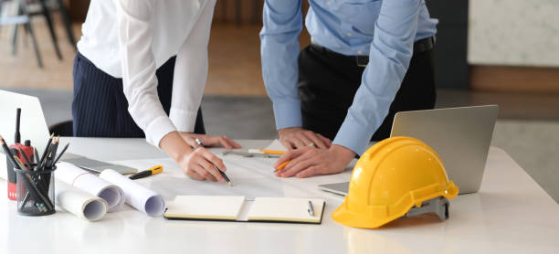 istock Designers colleagues discuss the sketches in office 1149270690