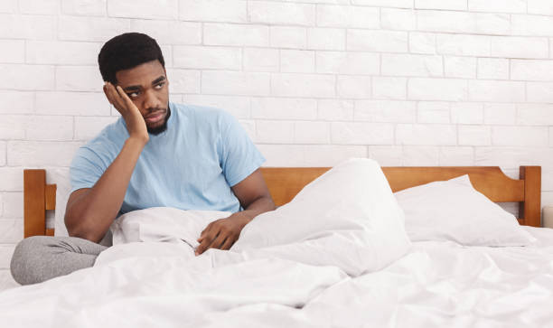 istock Thoughtful man considering breaking up with girlfriend in bed 1149271070