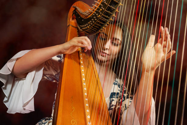 istock Professional female harpist during performance 1149272395