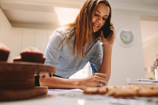 istock Confectioner taking orders over phone 1149273537