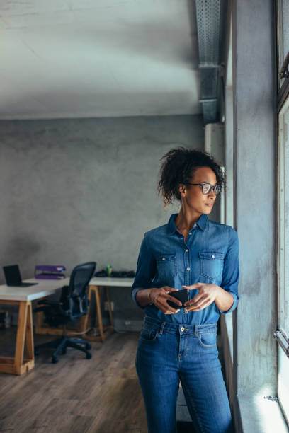 istock Woman entrepreneur looking out the window and thinking 1149274022