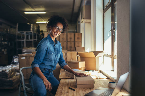 istock Woman packing the parcel for shipping 1149274033