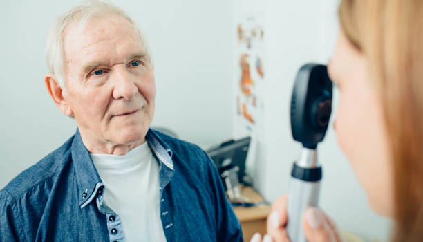 istock Senior man visiting optician, eye exam at clinic 1149275455
