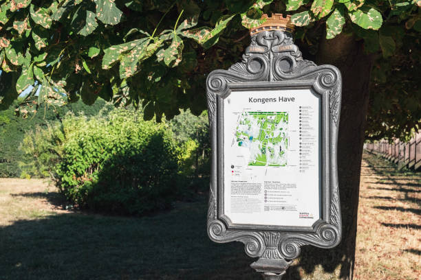 Stand for tourists in Kongens Have, Copenhagen Copenhagen, Denmark - August 7, 2018: Stand for tourists with map and information about Rosenborg Castle Gardens or Kongens Have. It is the oldest and most visited park in Copenhagen green valley denmark stock pictures, royalty-free photos & images