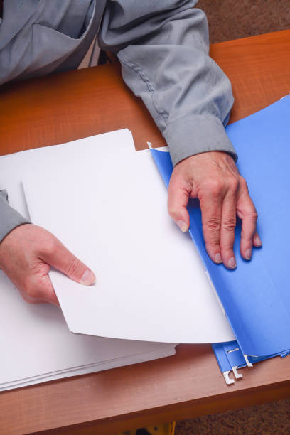 istock Putting away paper for organization 1149278685