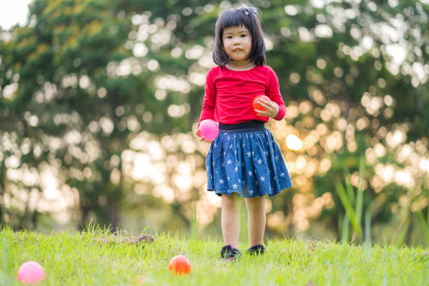 istock A girl is playing together on green grass 1149278930