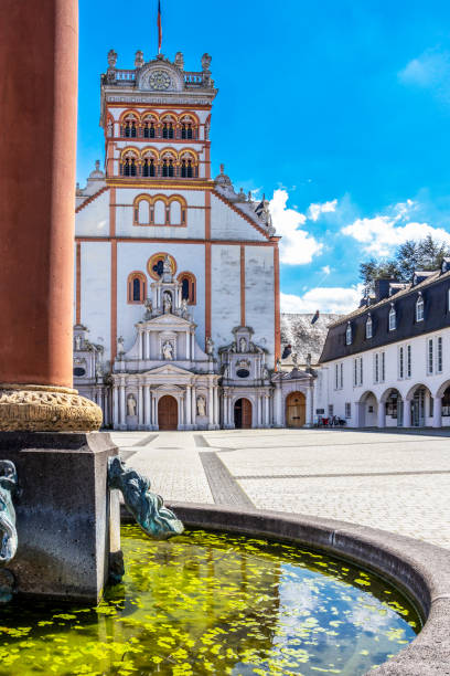 St. Matthias' Abbey in Trier, Rhineland-Palatinate, Germany behind the yard fountain column
