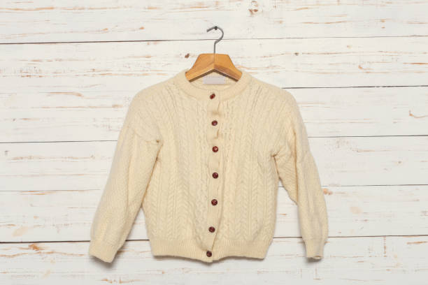 istock knitted sweater on wooden clothes rack 1149280446