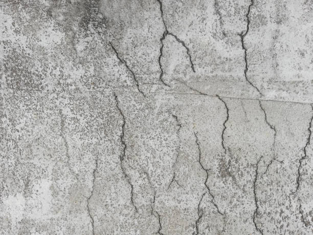 istock Cracked reinforced concrete on a surface due to shrinkage in the curing process 1149280625