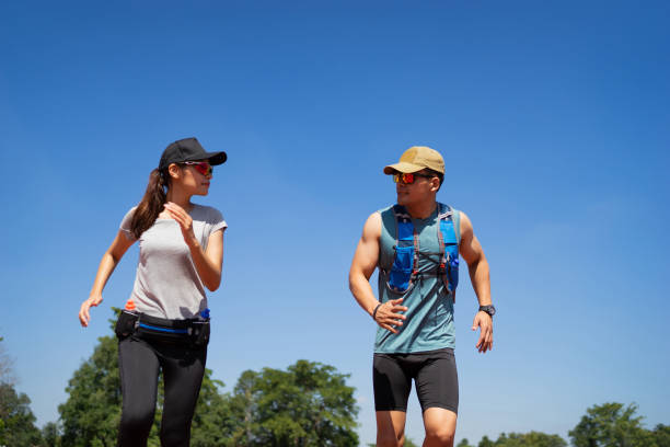 asian runner are rehearsing jogging, running on the pitch. - running jogging footpath cross country running imagens e fotografias de stock